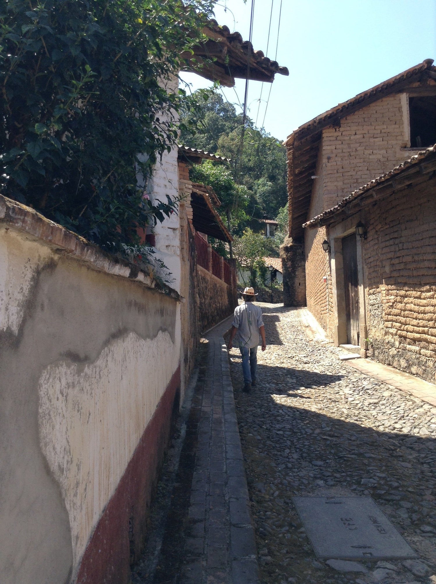 A stone street and low buildings in inland Jalisco, Mexico